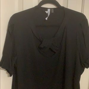 Black blouse. Crisscrossed cross neckline